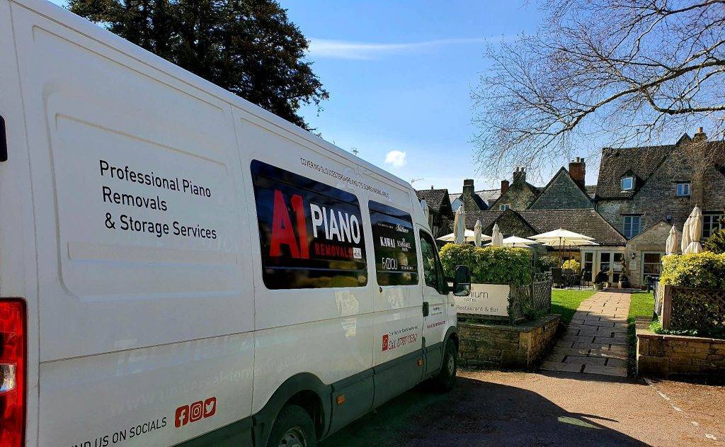 A1 pianos van parked on a street