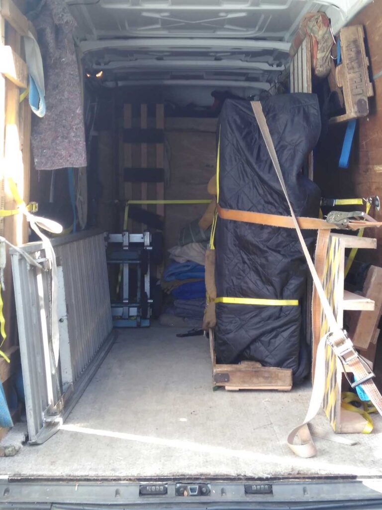 Grand piano being carefully transported